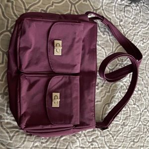 Magellan’s purple 4 pocket purse with 7 compartments in the inside.